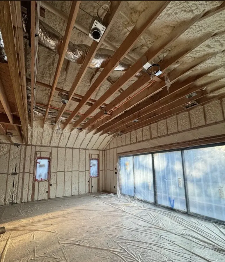 Interior walls and ceiling insulated with spray foam during new construction in Island Park